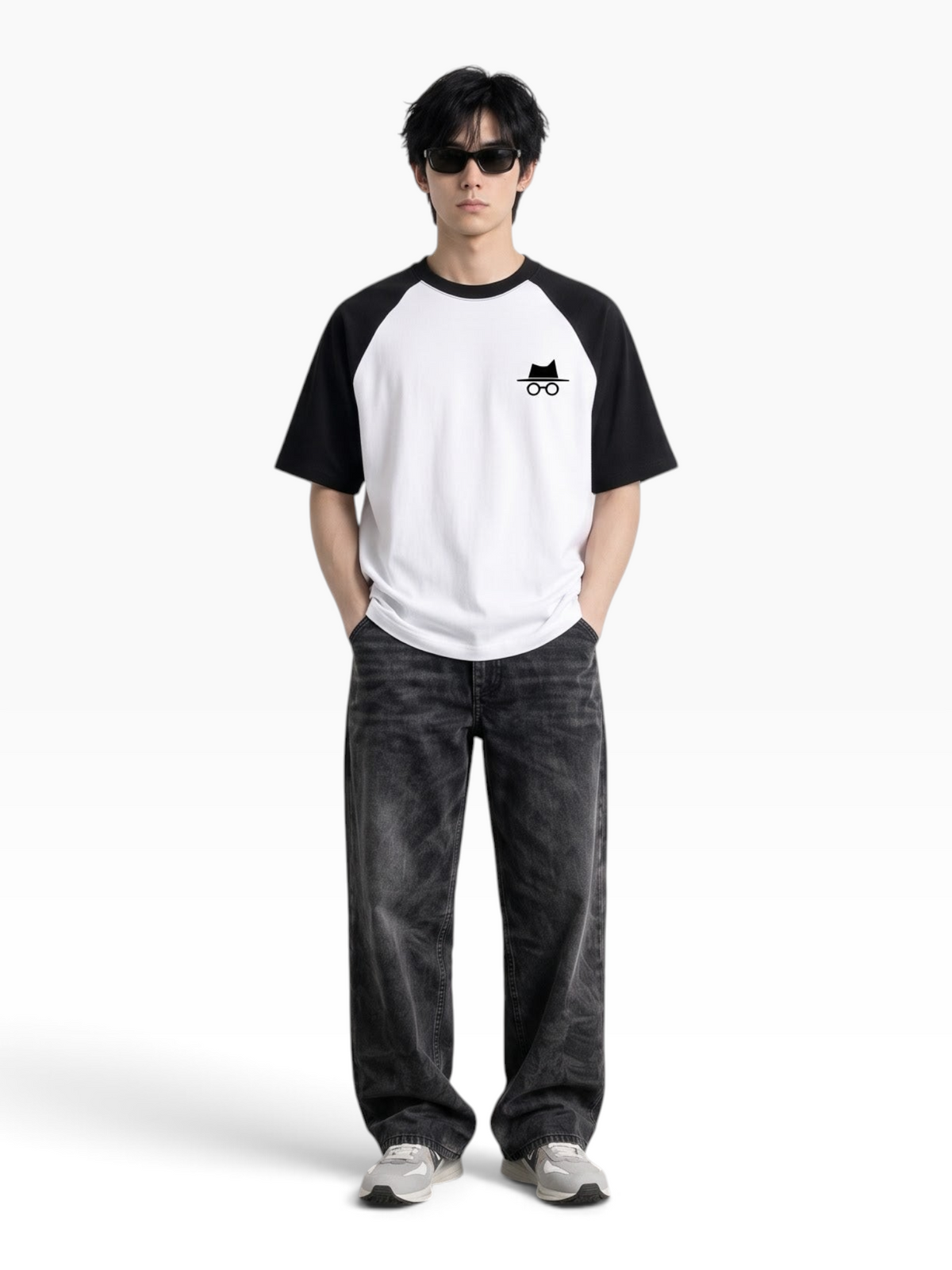 E7 unisex oversized raglan t-shirt in white and black cotton with a small logo on the chest worn by a male model.
