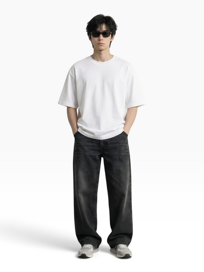 E7 unisex oversized white heavyweight cotton t-shirt worn by a man with sunglasses and black jeans