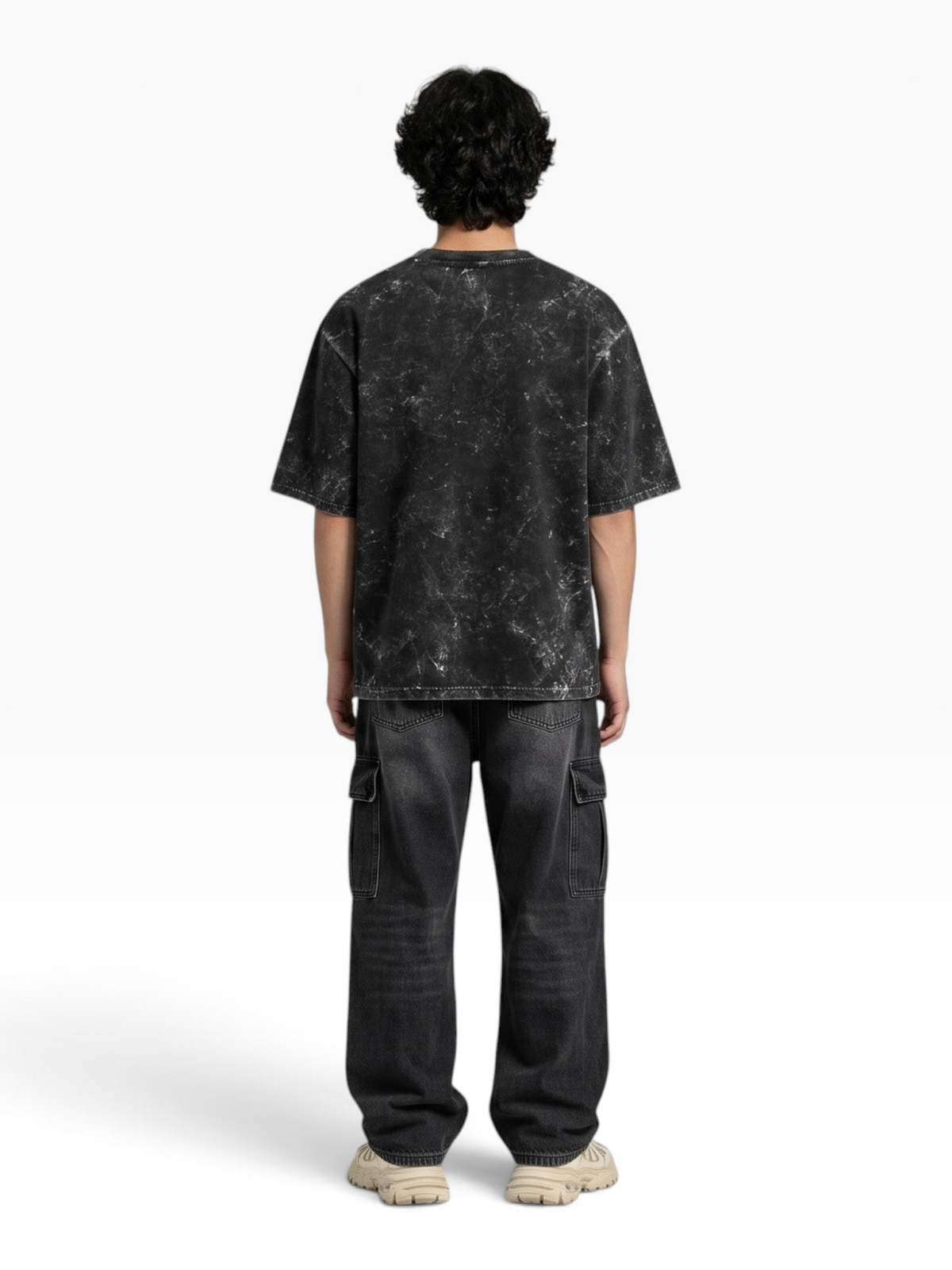 Back view of a person wearing an E7 unisex oversized heavyweight cotton t-shirt with a black acid-washed finish.