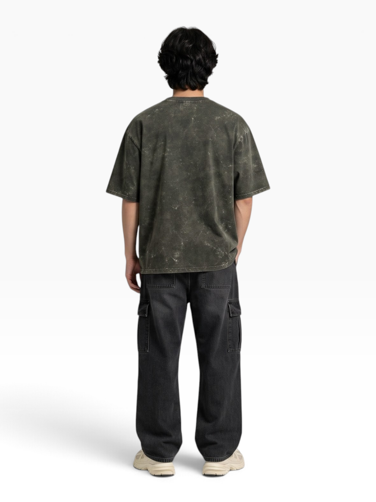 Back view of a person wearing an E7 unisex oversized heavyweight cotton t-shirt with a dark grey acid-washed finish.