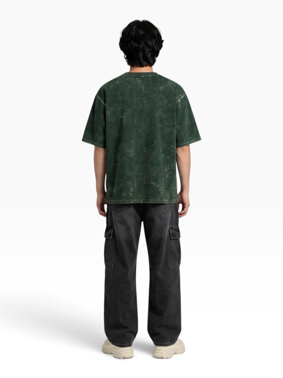 Back view of a person wearing an E7 unisex oversized green acid-washed cotton t-shirt with a relaxed streetwear fit.
