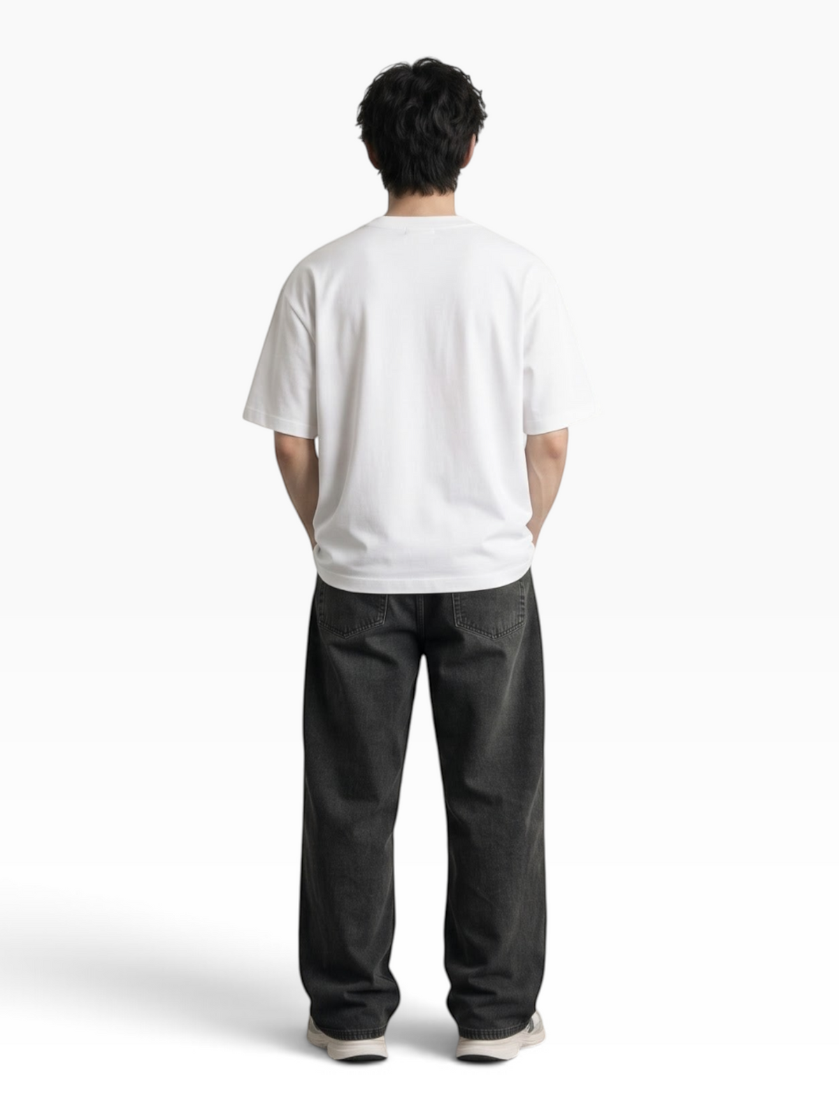 Back view of a man wearing an E7 white heavyweight cotton oversized t-shirt with a slouchy fit