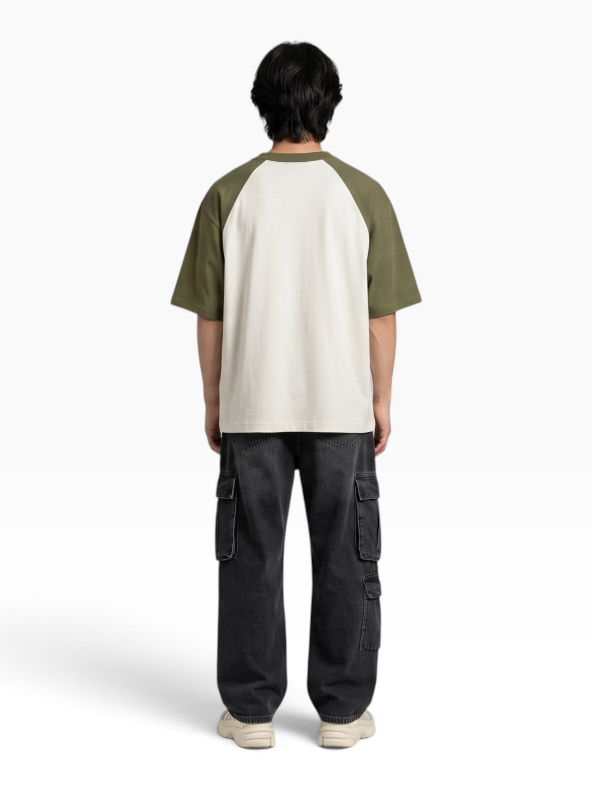 Back view of a person wearing an E7 oversized raglan t-shirt with olive green sleeves and a cream body.